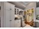Bright kitchen featuring white cabinets, stainless steel refrigerator, and granite countertops at 4494 Aberdeen Way, Myrtle Beach, SC 29579