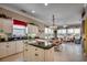 Bright kitchen featuring a center island and a breakfast nook with white wicker chairs at 4494 Aberdeen Way, Myrtle Beach, SC 29579