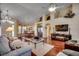 Open-concept living room with hardwood floors and vaulted ceilings at 4494 Aberdeen Way, Myrtle Beach, SC 29579