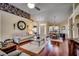 Bright living room showcasing hardwood floors and abundant natural light at 4494 Aberdeen Way, Myrtle Beach, SC 29579
