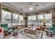 Cozy sunroom with bright windows, tile flooring, and comfortable seating at 4494 Aberdeen Way, Myrtle Beach, SC 29579