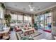 Bright living room boasting large windows, tile flooring, and comfortable furnishings at 4494 Aberdeen Way, Myrtle Beach, SC 29579