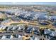 Aerial shot showcases condos surrounding a marina with boats docked on the water at 4535 Lightkeepers Dr. # 27B, Little River, SC 29566