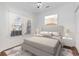 Bright bedroom with a large window, neutral décor, and ample natural light at 4535 Lightkeepers Dr. # 27B, Little River, SC 29566