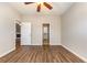 Spacious bedroom features wood-look floors, ceiling fan, and ensuite bath and closet at 4535 Lightkeepers Dr. # 27B, Little River, SC 29566