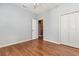 This bedroom features wood-look floors, a ceiling fan, and a closet at 4535 Lightkeepers Dr. # 27B, Little River, SC 29566