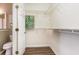 A walk in closet with white shelving, hanging rods, and durable flooring at 4535 Lightkeepers Dr. # 27B, Little River, SC 29566