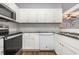 Clean kitchen with ample counter space, white cabinets, and stainless steel appliances at 4535 Lightkeepers Dr. # 27B, Little River, SC 29566