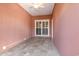 Enclosed sun room with tile flooring, fan, and a large window at 4535 Lightkeepers Dr. # 27B, Little River, SC 29566