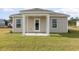 Inviting covered patio area with sleek columns, ideal for relaxation or entertaining guests outdoors at 457 Acosta Circle, Conway, SC 29527