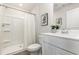 Bright bathroom with a shower/tub combo, white vanity, and decorative mirror at 457 Acosta Circle, Conway, SC 29527