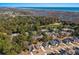An aerial view of a neighborhood near the coast, surrounded by trees and blue waters at 48 Twelve Oaks Dr. # 3, Pawleys Island, SC 29585