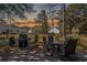 Outdoor patio area with a grill and dining set, perfect for enjoying backyard sunsets at 48 Twelve Oaks Dr. # 3, Pawleys Island, SC 29585
