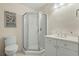 Bathroom featuring a glass-enclosed shower, toilet, and a vanity, offering a clean and functional space at 48 Twelve Oaks Dr. # 3, Pawleys Island, SC 29585