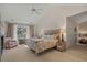 Bright bedroom featuring a decorative fireplace, ample natural light, and neutral color scheme at 48 Twelve Oaks Dr. # 3, Pawleys Island, SC 29585