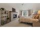 Comfortable bedroom featuring a decorative fireplace, ample natural light, and neutral color scheme at 48 Twelve Oaks Dr. # 3, Pawleys Island, SC 29585