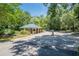 Picturesque community entry gatehouse surrounded by mature trees and landscaping at 48 Twelve Oaks Dr. # 3, Pawleys Island, SC 29585