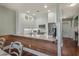 Modern kitchen with white cabinetry and breakfast bar, offering both style and functionality for culinary enthusiasts at 48 Twelve Oaks Dr. # 3, Pawleys Island, SC 29585