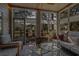 Cozy screened porch with comfortable seating, ideal for relaxation and enjoying the outdoor views at 48 Twelve Oaks Dr. # 3, Pawleys Island, SC 29585