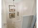 Well-lit staircase with carpeted steps and decorative wall art, creating an inviting transition between floors at 48 Twelve Oaks Dr. # 3, Pawleys Island, SC 29585