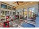 Sunroom with glass windows and doors, comfortable furniture, and a ceiling fan, perfect for relaxing at 48 Twelve Oaks Dr. # 3, Pawleys Island, SC 29585