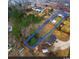 Aerial view of a property with boundaries marked, showcasing house, outbuildings, and surrounding trees at 4908 Main St., Loris, SC 29569