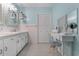 Bathroom with dual vanity, walk-in shower, and dressing table at 4908 Main St., Loris, SC 29569
