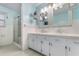 Bathroom featuring dual sinks, vanity, and glass shower at 4908 Main St., Loris, SC 29569