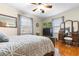 Comfortable bedroom with hardwood floors, a large window, and vintage decor at 4908 Main St., Loris, SC 29569