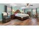Spacious bedroom featuring a large wooden bed frame and hardwood floors at 4908 Main St., Loris, SC 29569