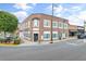 Exterior view of a two-story brick building featuring multiple windows and street-side accessibility at 4908 Main St., Loris, SC 29569