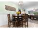 Cozy dining area featuring a wooden table with seating for four, seamlessly connected to the living space at 4908 Main St., Loris, SC 29569