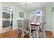 Bright dining room with hardwood floors, and a view into the adjacent kitchen at 4908 Main St., Loris, SC 29569