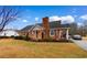 Charming brick home with a well-maintained lawn, inviting curb appeal, and covered parking space at 4908 Main St., Loris, SC 29569