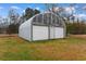 Exterior of the metal garage with white doors and ample space at 4908 Main St., Loris, SC 29569