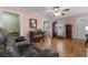 A beautiful living room with hardwood floors and an archway leading to the dining room at 4908 Main St., Loris, SC 29569