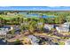 Scenic aerial view of the property, featuring a golf course, a lake, and well-maintained community buildings at 4929 Pond Shoals Ct. # 201, Myrtle Beach, SC 29579