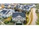 Aerial view of waterfront townhomes, surrounded by lush landscaping and mature trees at 4929 Pond Shoals Ct. # 201, Myrtle Beach, SC 29579