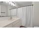 Bathroom with a large mirror and white shower curtain at 4929 Pond Shoals Ct. # 201, Myrtle Beach, SC 29579