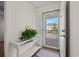 Bright entryway featuring a stylish console table, plant, and a clear view to the exterior at 4929 Pond Shoals Ct. # 201, Myrtle Beach, SC 29579