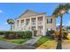 Inviting condo exterior featuring a well-manicured lawn and a charming walkway to the entrance at 4929 Pond Shoals Ct. # 201, Myrtle Beach, SC 29579