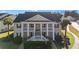 Charming two-story condo with classic architecture and beautifully landscaped front yard at 4929 Pond Shoals Ct. # 201, Myrtle Beach, SC 29579
