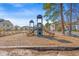Community playground area featuring slides, climbing structures, and a soft mulch ground at 4929 Pond Shoals Ct. # 201, Myrtle Beach, SC 29579