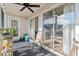 Relaxing porch features tile flooring, ceiling fan, and views from sliding glass door at 4929 Pond Shoals Ct. # 201, Myrtle Beach, SC 29579