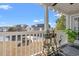 Relaxing porch featuring outdoor decor and serene water views at 4929 Pond Shoals Ct. # 201, Myrtle Beach, SC 29579
