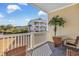 Spacious balcony with comfortable seating and views of the lawn and neighboring buildings at 5801 Oyster Catcher Dr. # 822, North Myrtle Beach, SC 29582