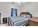 Cozy bedroom with a large bed, soft lighting and a ceiling fan at 5801 Oyster Catcher Dr. # 822, North Myrtle Beach, SC 29582