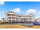 Beautiful condo building featuring multiple units, balconies, and well-maintained landscaping, with an attached parking spot at 5801 Oyster Catcher Dr. # 822, North Myrtle Beach, SC 29582