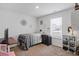 Comfortable bedroom with natural light, perfect for relaxing and enjoying a peaceful retreat at 519 Grass Fern Ct., Longs, SC 29568
