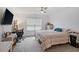 Bright bedroom with lots of furniture, a window, ceiling fan, and lots of natural light at 519 Grass Fern Ct., Longs, SC 29568